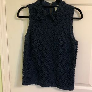 Anthropologie top in navy blue with lace collar in xs.